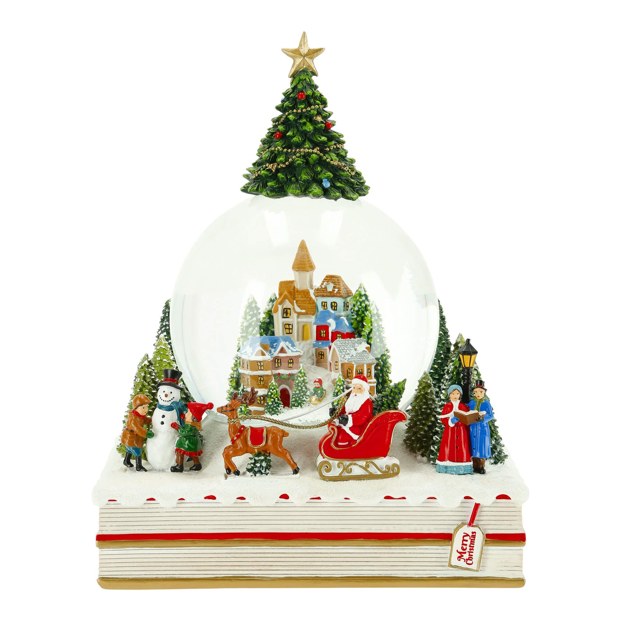 Schneekugel Weihnachtslandschaft auf einem Buch